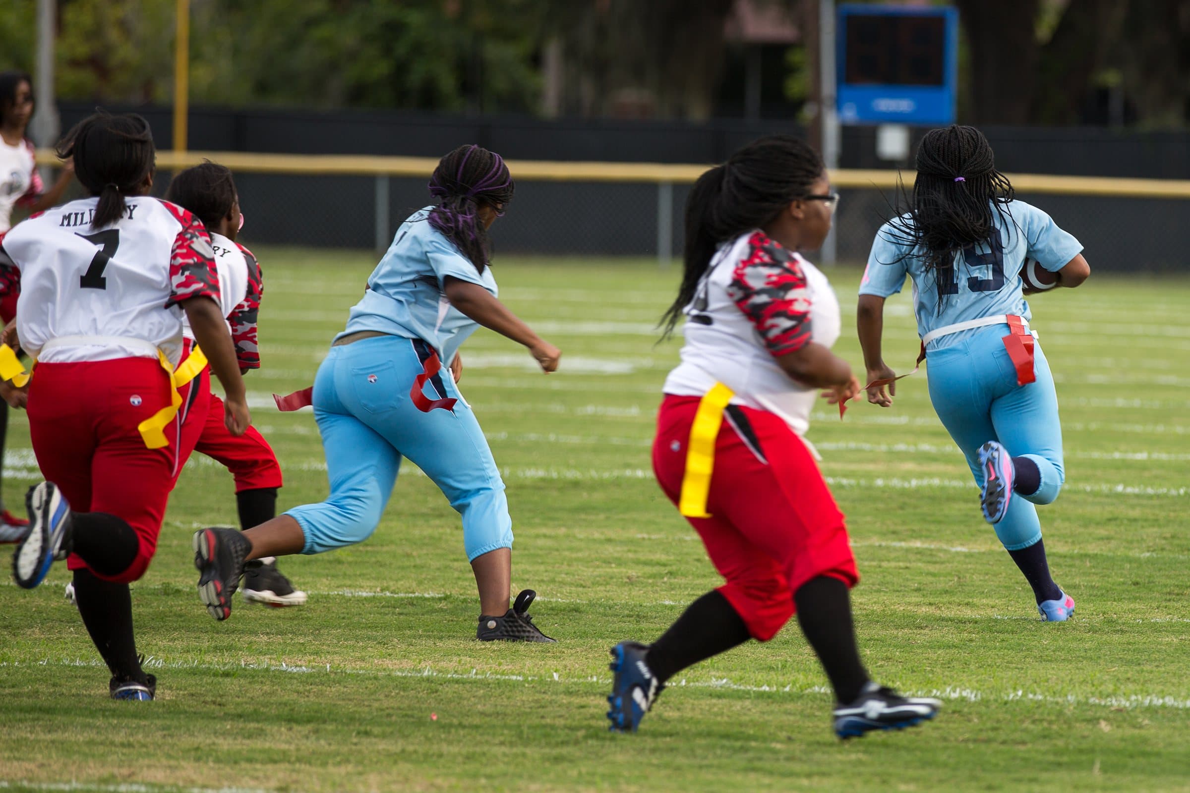 North Charleston girls' flag football — runner pulling away with the ball